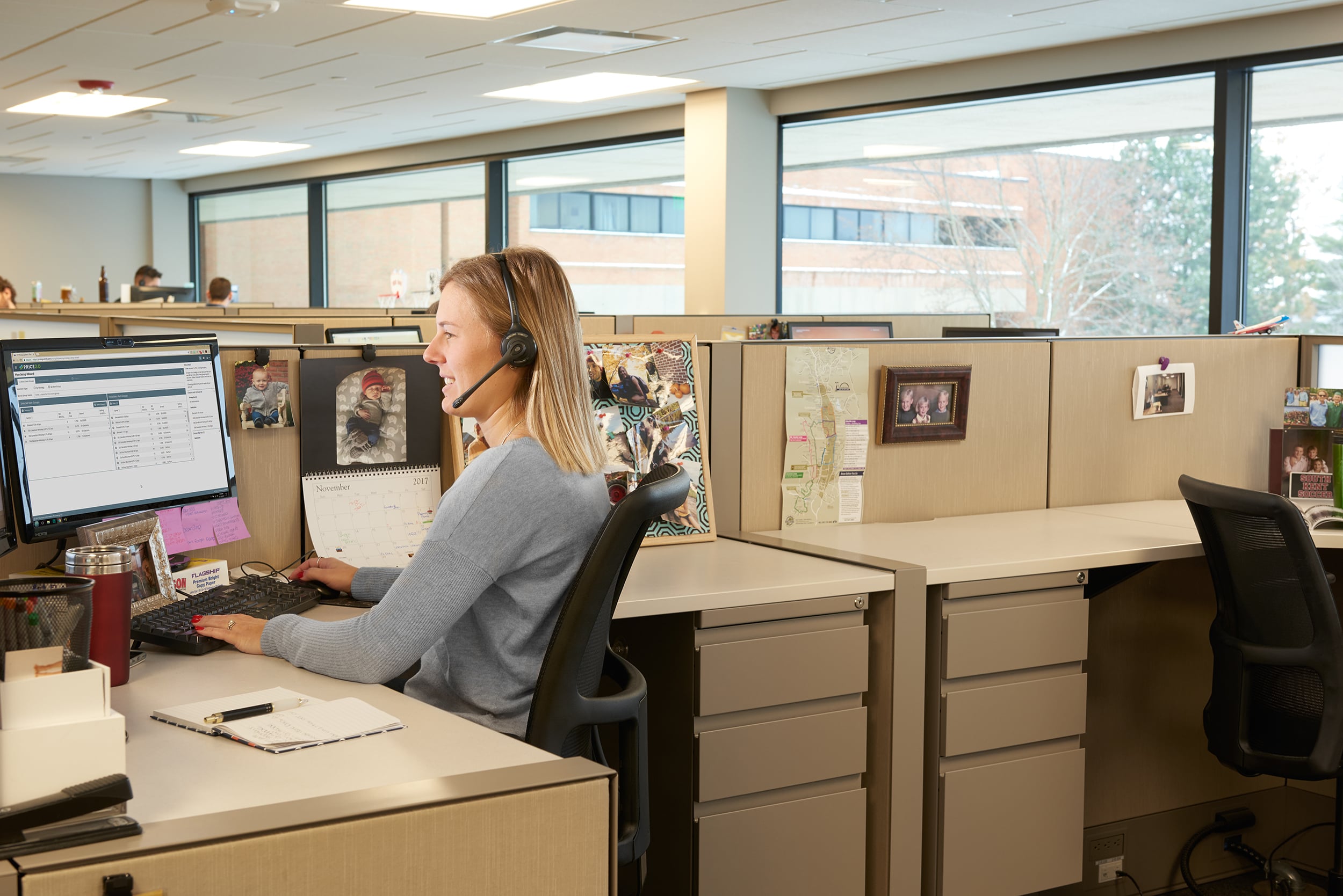 woman at desk with headset